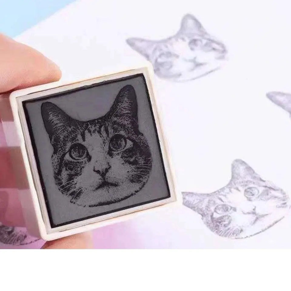 Enlarged bottom stamp part of the head of cat portrait and two prints beside showcasing accuracy