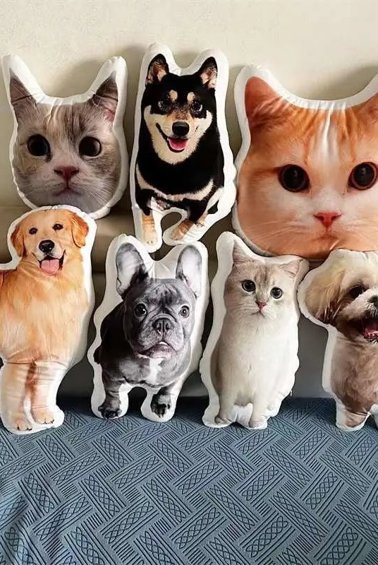 A golden retriever pillow and French bulldog pillow together with other custom throw pillows on a sofa