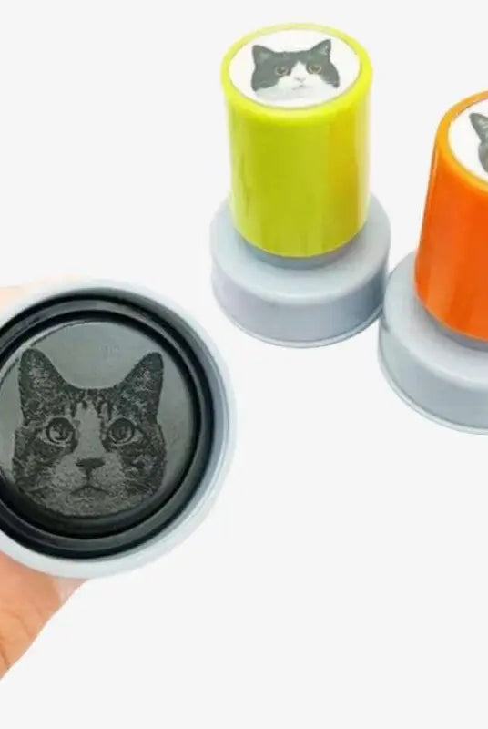 Two round shape of custom stamps with cat head part displaying to customers