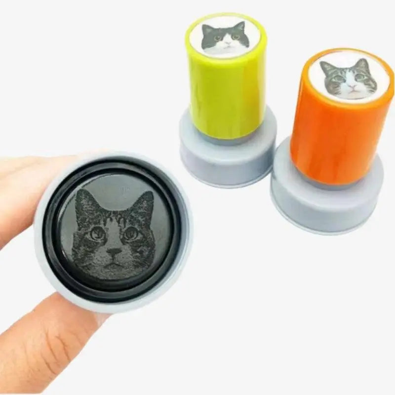 Two round shape of custom stamps with cat head part displaying to customers