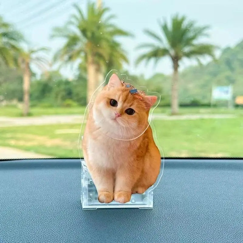 Custom pet bobblehead with ginger cat portrait in playful head-tilting pose.