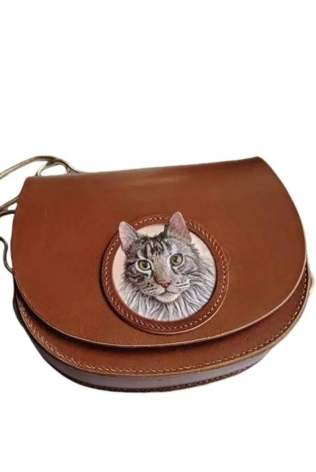 Handmade leather cat portrait with antique brass buckle and crossbody strap