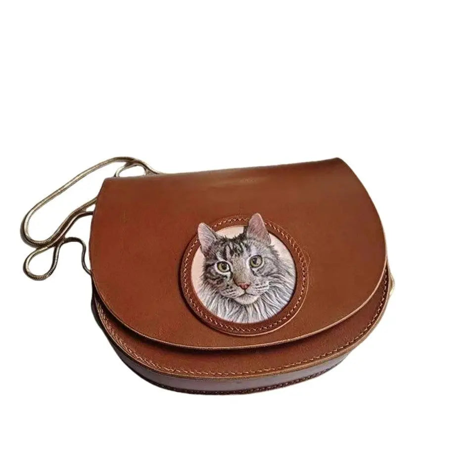 Handmade leather cat portrait with antique brass buckle and crossbody strap