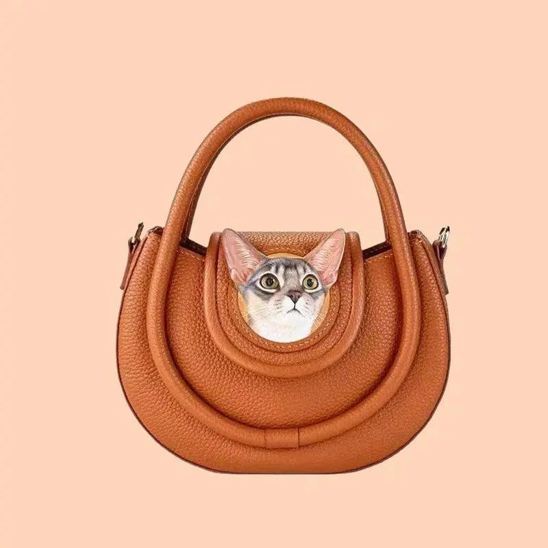 front view of a handmade handbag carved with cat