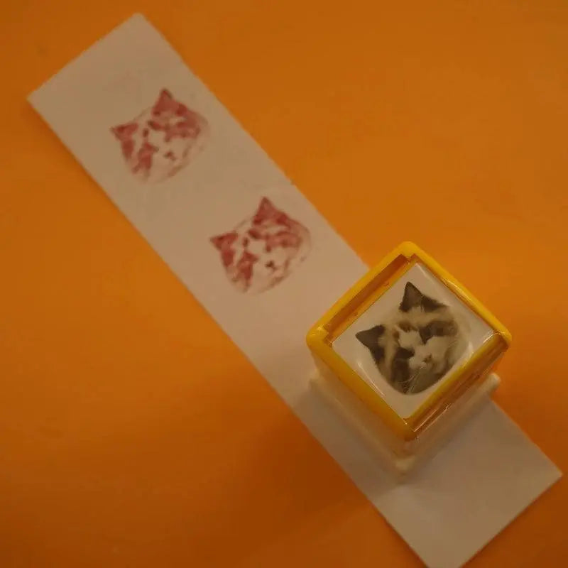 over view of the custom stamp with red prints on paper