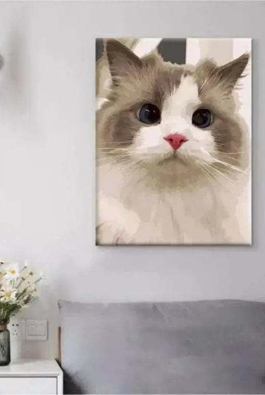 unframed finished cat painting hanging on the wall in bedroor scene