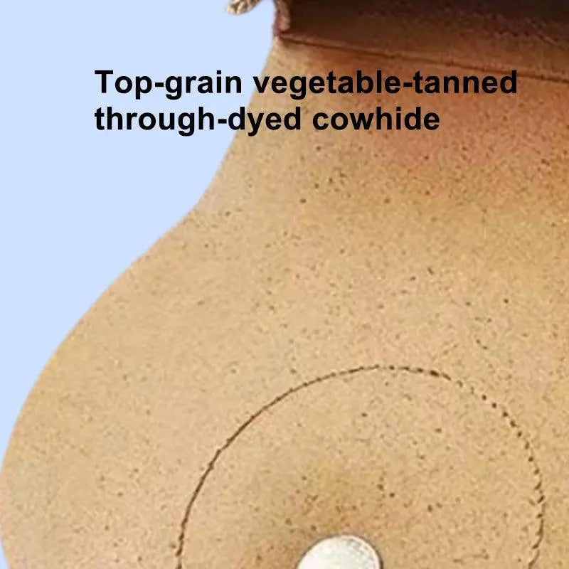 Close-up of natural grain texture and hand-burnished edges on full-grain leather pet saddle bag.