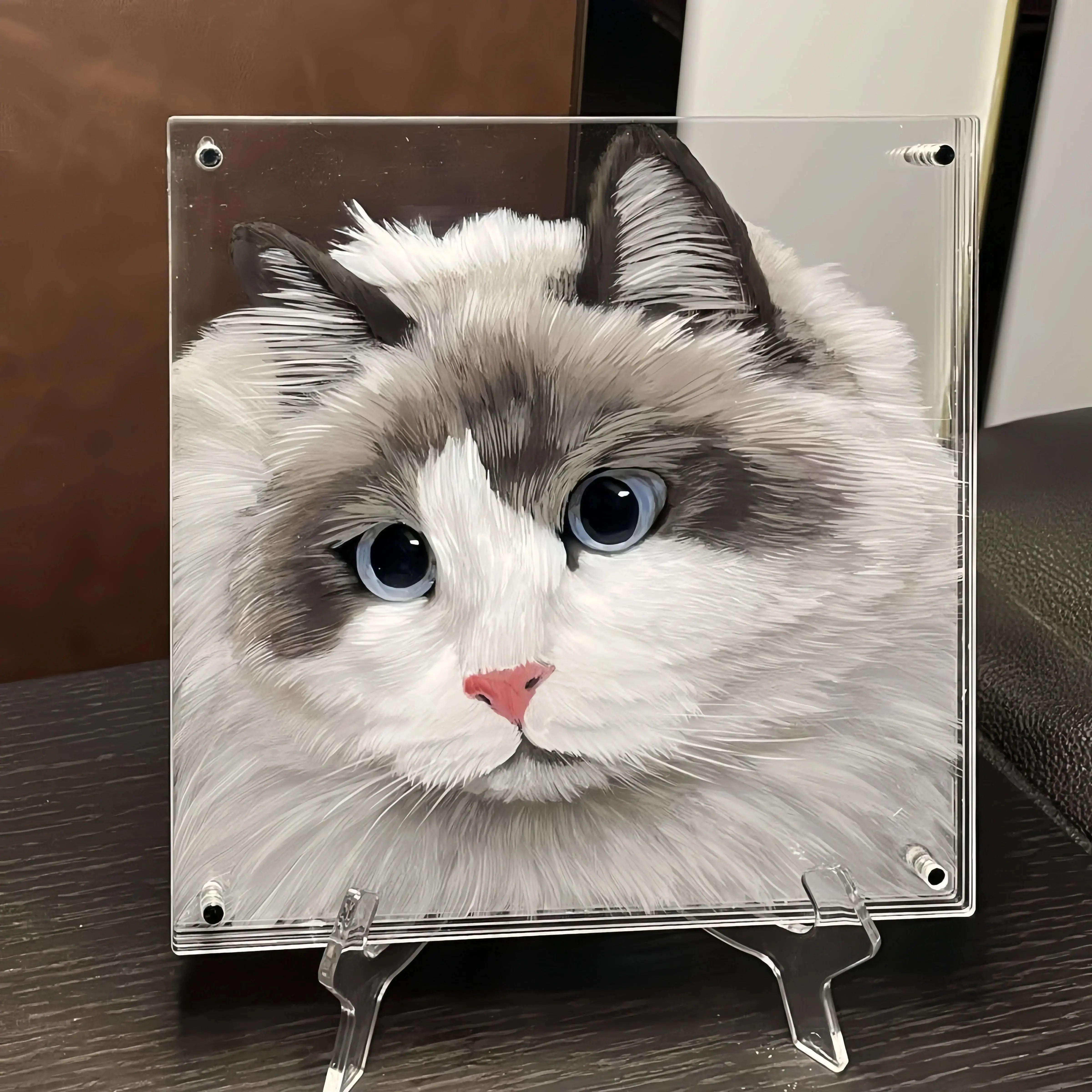Angled view of 5-layer acrylic cat portrait creating lifelike dimensional shadows.
