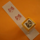 over view of the custom stamp with red prints on  paper