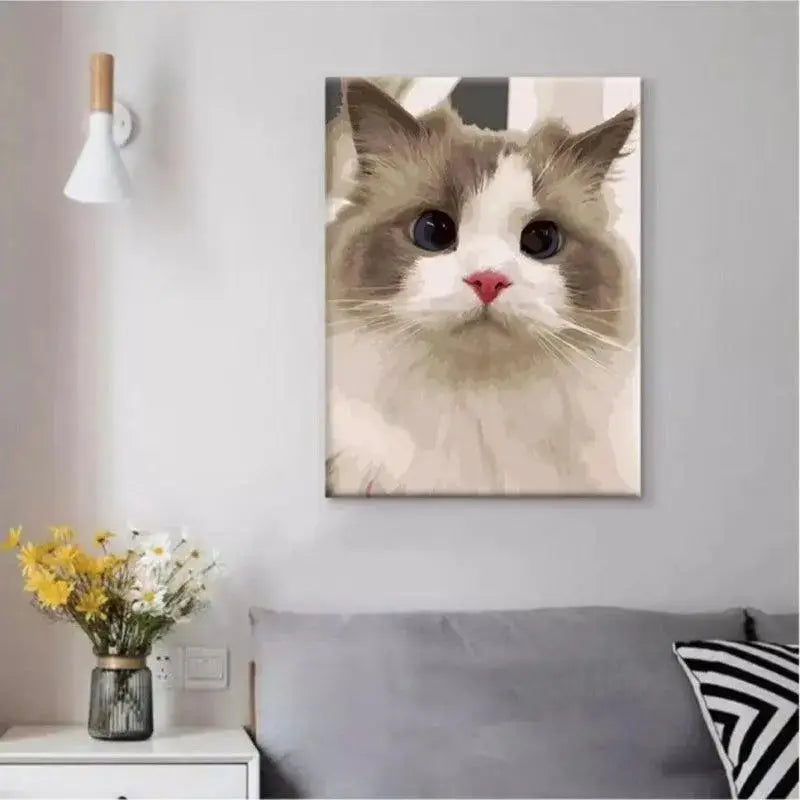 unframed finished cat painting hanging on the wall in bedroor scene